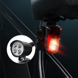 Bicycle lights, including a white front light and red rear light, on a dark background.
