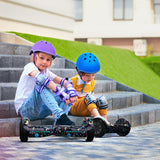 Two kids in helmets and protective gear sit on outdoor steps with iHoverboard Hoverboard for Kids, 6.5" Self-Balancing with Bluetooth LED Lights, CE Certified-H1. Relaxed and safe, they enjoy a sunny urban day with their colorful hoverboards.