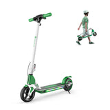 A sleek green and white electric scooter with LED lights on the deck is prominently displayed. In the background, a child wearing a helmet and striped shirt walks while carrying a folded scooter, matching the color scheme.