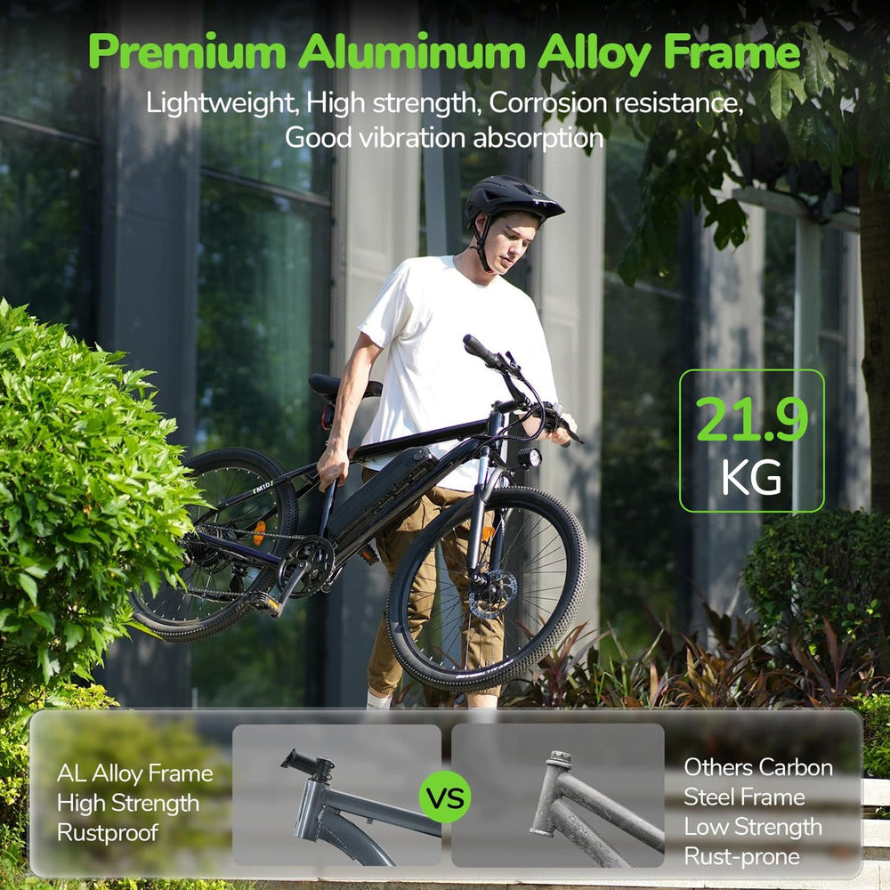 A person wearing a helmet is carrying a black bicycle M10 with a premium aluminum alloy frame, highlighted for its lightweight and rustproof qualities. The bike weighs 21.9 kg, and the image contrasts its high strength against a rust-prone steel frame.