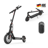 A sleek black electric scooter is shown in both upright and folded positions, featuring a sturdy frame and textured wheels. The scooter includes a small headlight and a visible kickstand. A separate image displays a black carrying case, and a German flag with "ABE Approved" is visible in the corner.