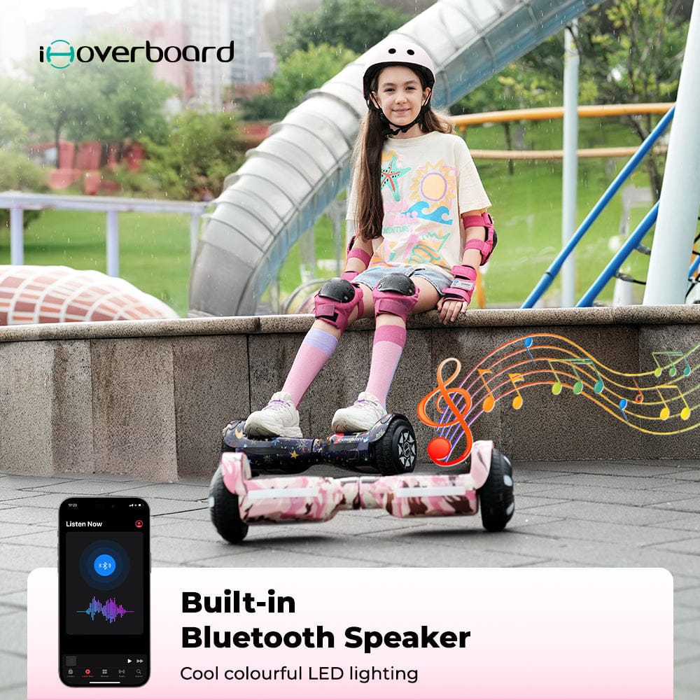 A young girl wearing protective gear and a helmet sits on a ledge in a park, next to a pink hoverboard with colorful LED lights. Musical notes illustrate the built-in Bluetooth speaker feature. A smartphone screen shows music playing.