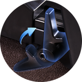 A close-up of a JT51 black lever with a blue arrow indicating its movement direction, set against a textured brown surface.