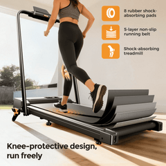 A woman runs on a treadmill JT52 with a knee-protective design, featuring 8 rubber shock-absorbing pads and a 5-layer non-slip running belt, in a bright indoor setting.