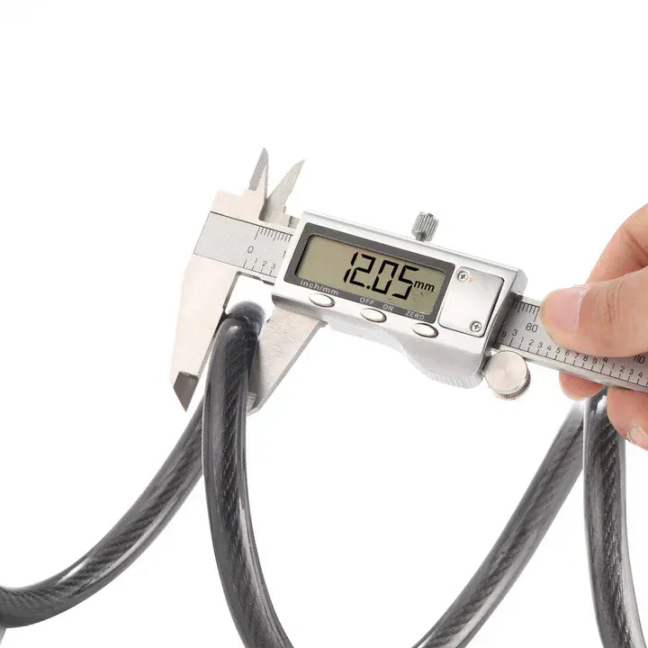 A digital caliper measuring the diameter of a black cable, displaying 12.05 mm on its screen, with a hand holding the tool against a white background.