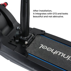 A close-up of a black electric scooter's footboard, featuring a sturdy mounting bracket and a sleek design, with the text "After installation, it integrates with GT2 and looks beautiful and not obtrusive.".