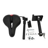 A scooter seat kit is displayed, featuring a black seat with a red accent, a suspension seat post, and an assortment of installation tools and hardware, including a wrench and bolts, all set against a plain white background.