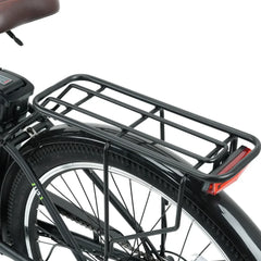 A black bicycle rear rack is attached above a sturdy tire with a fender, featuring a simple, open-frame design and a red reflector at the back.