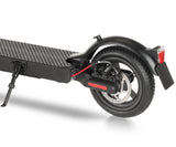 The image shows the rear section of a black e9pro electric scooter, featuring a textured deck, a sturdy kickstand, and a rear wheel with a disc brake. A red reflector and taillight are visible above the wheel, along with a red brake cable.