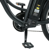 Close-up of an electric bike's central frame showing the black battery pack, pedal, and chain mechanism, with visible labels and a sturdy black finish.