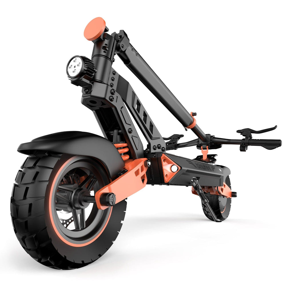 A black and orange folding electric scooter D2 positioned at an angle, showcasing its large rear tire and front light. The scooter's arm is compacted for storage.
