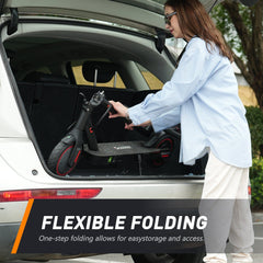 A person in a blue shirt places a folded black electric scooter with red accents into the trunk of a white car, highlighting the scooter's easy storage feature.