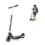 A sleek black electric scooter ik1s
with a sturdy frame and large wheels is shown, featuring a kickstand and the brand name "iScooter" on the deck. In the background, a young person is joyfully riding a similar scooter, wearing casual clothing and sneakers.