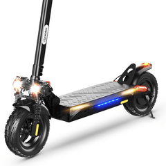 A black electric scooter ix4 is shown with bright front headlights and illuminated yellow signal lights on the sides. The rear wheel features a glowing red brake light, emphasizing its enhanced night visibility features.