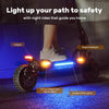 A person rides an electric scooter ix7pro at night, featuring bright headlights, taillights, left and right turn signal lights, and ambient side lights, illuminating the path for enhanced safety.