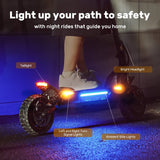 A person rides an electric scooter ix7pro at night, featuring bright headlights, taillights, left and right turn signal lights, and ambient side lights, illuminating the path for enhanced safety.