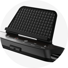 A close-up of a treadmill JT51 control panel with a textured black phone holder above it. The panel features buttons for start/stop, speed adjustment, and other functions, set against a sleek black surface.