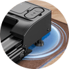 A close-up of a black JT51 treadmill's corner, featuring its sleek control buttons and sturdy support leg on a wooden floor, with a blue circular light effect emanating from underneath.