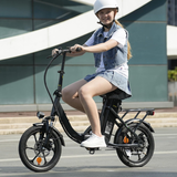 Person riding U4 electric bike through urban commuting scene