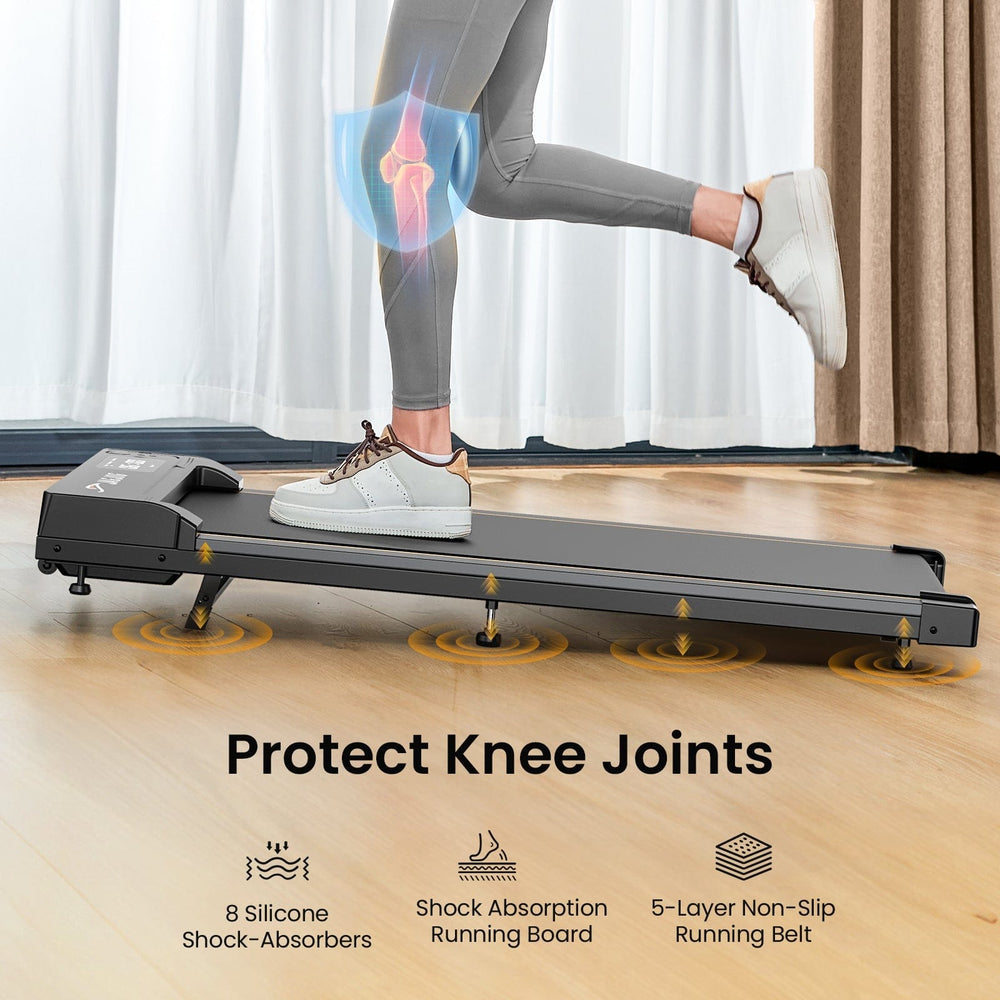 A person in gray leggings and white sneakers is running on a sleek treadmill JT31 with a focus on knee protection, featuring a digital overlay of a knee joint. The treadmill is equipped with 8 silicone shock absorbers, a shock absorption running board, and a 5-layer non-slip running belt, set in a room with wooden flooring and curtains.
