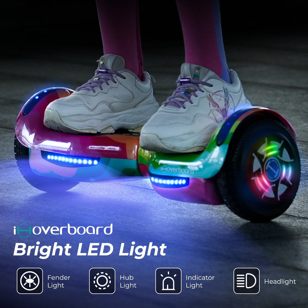 A person wears white sneakers while riding the iHoverboard 6.5" Hoverboard for Kids, featuring Bluetooth, bright LED fender and hub lights, indicator light, headlight, and CE Certification. Text: Hoverboard for Kids with LED Lights.