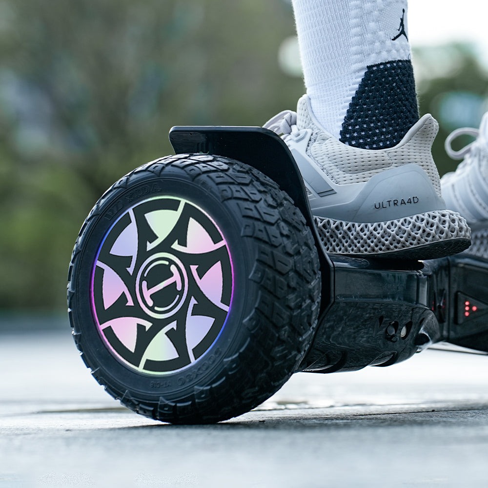 Close-up of a hoverboard wheel with a colorful design, blurred background