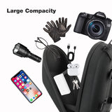 Black scooter head bag with camera, phone, keys, and other items on a white background