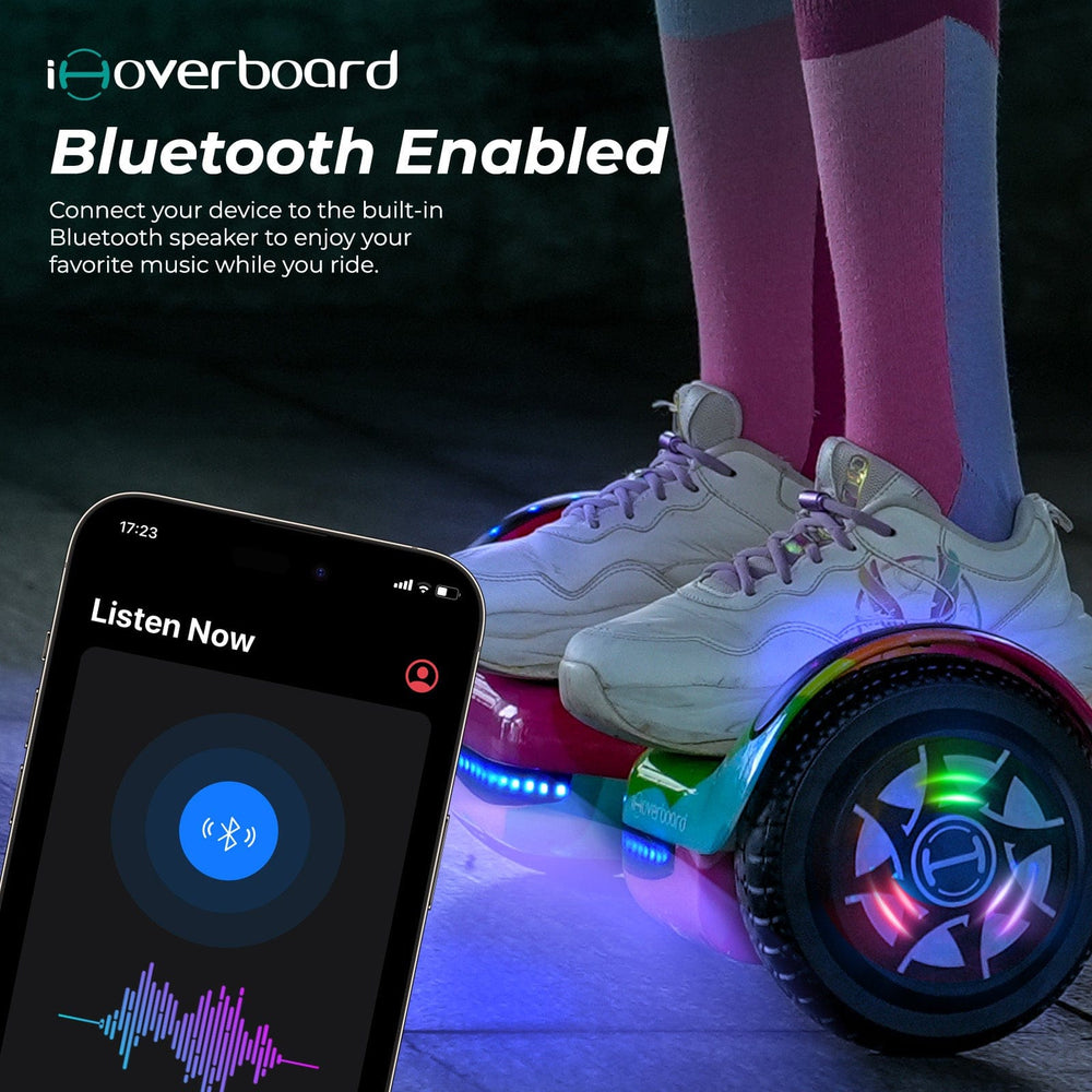 A person in white sneakers and pink socks rides the iHoverboard Hoverboard for Kids, 6.5" Self-Balancing with Bluetooth LED Lights (CE Certified-H1). In front, a smartphone displays a music app. Text: iHoverboard Bluetooth Enabled.