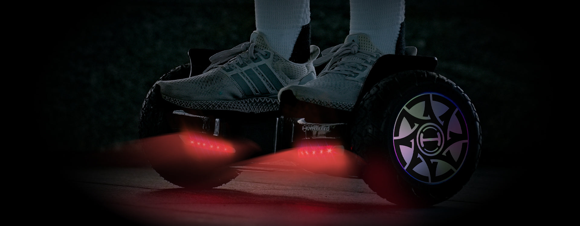 The iHoverboard H8's vibrant LED lighting system illuminates a night ride, ensuring both safety and style after dark.