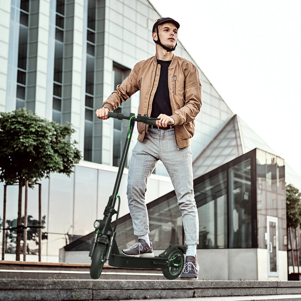 Man riding an electric scooter in an urban setting