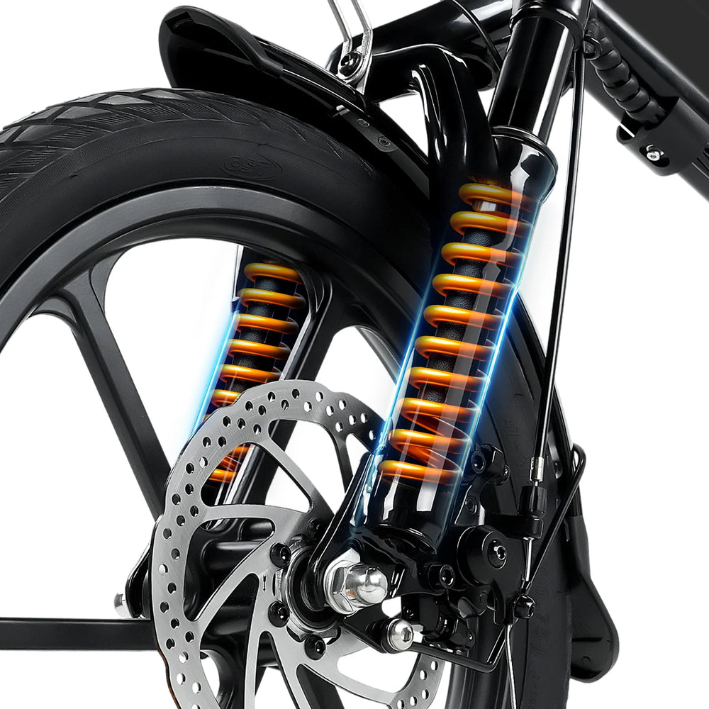 Close-up of a electric bike suspension system with orange spring coils on a white background