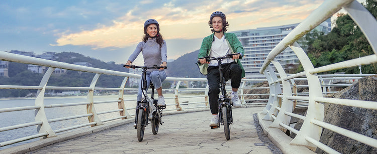 A view of the isinwheel U3 being ridden on a typical European cobblestone street, demonstrating its comfort.