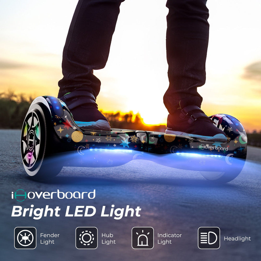 At sunset, a child rides the iHoverboard Hoverboard for Kids, 6.5" Self-Balancing with Bluetooth and LED lights. Icons show fender, hub, indicator lights, and headlights on this CE Certified-H1 model. The iHoverboard brand name is visible.