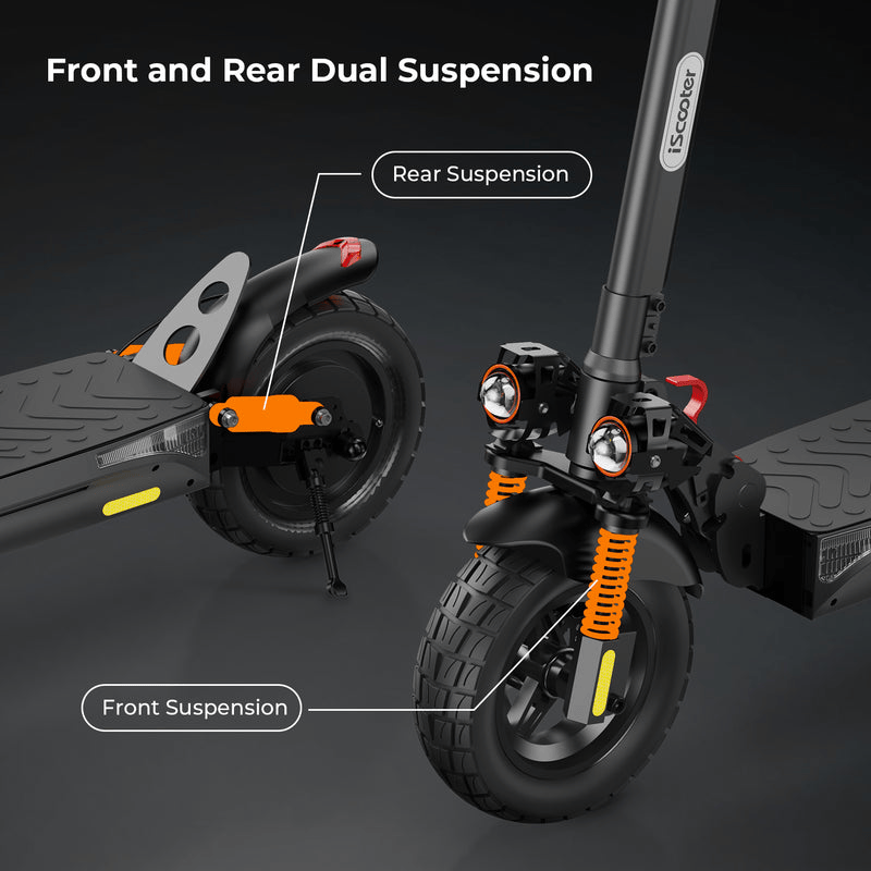 A close-up of an ix4 electric scooter highlighting its front and rear dual suspension system, with orange suspension springs and large black tires, set against a dark background.