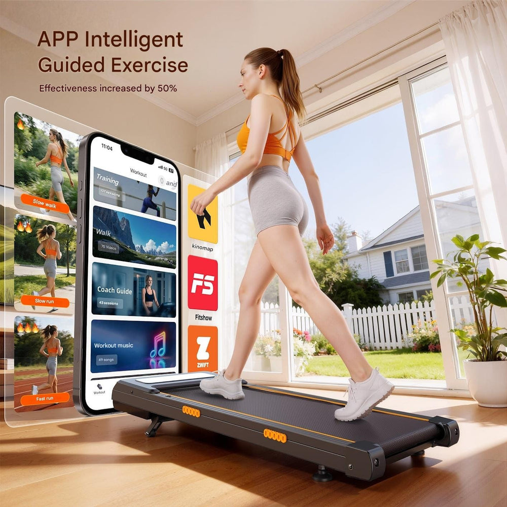 A woman exercises on a sleek treadmill in a bright room with large windows showing a sunny backyard. She wears an orange sports top and gray shorts. Next to her, a large virtual display showcases various fitness app options, including training, walking, and workout music.